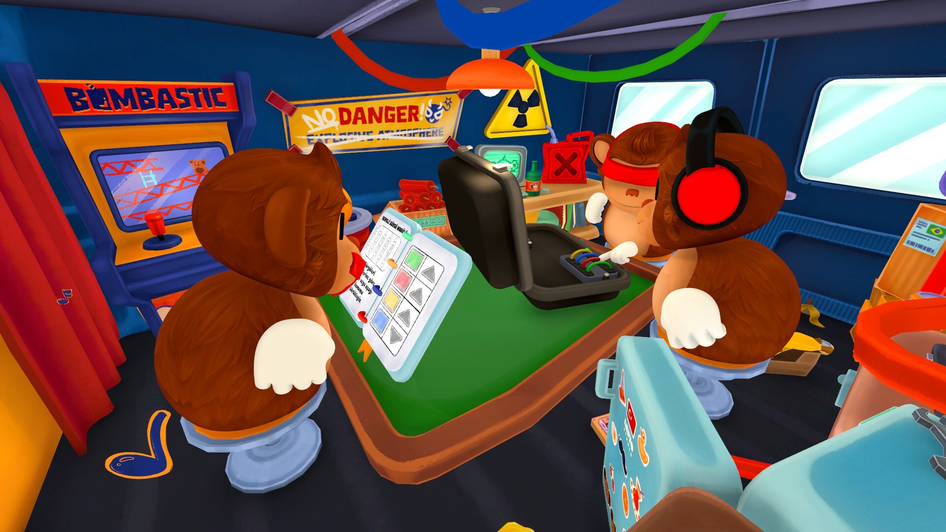 Mute monkey relaying instructions beside the BOMBANANA manual